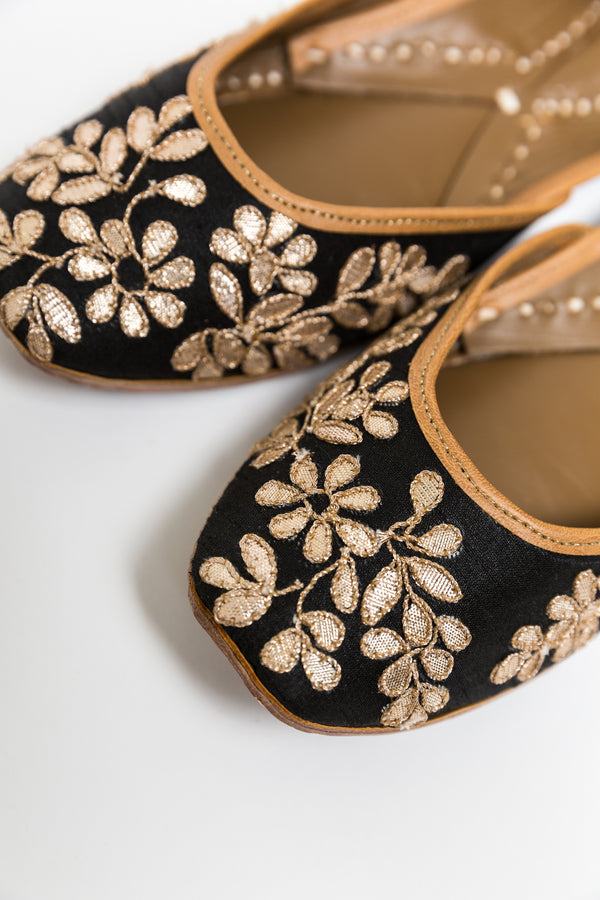 Handcrafted black flats, inspired by South Asian Khussa/Jutti design. Made with 100% genuine leather. Comfortable fancy flats perfect for any occasion. A classic black flat, with golden gota that goes perfectly with every outfit in your wardrobe.  