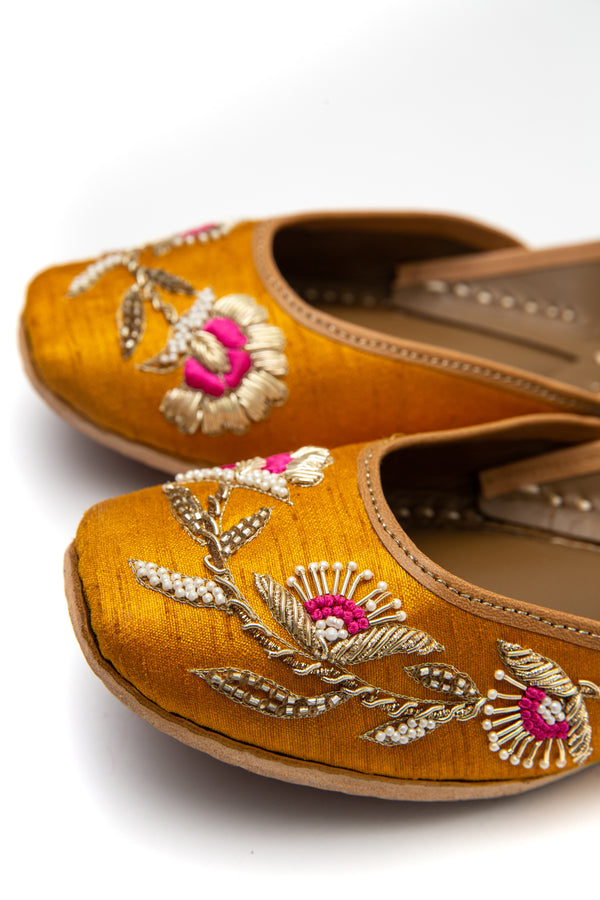 Handcrafted yellow flats, inspired by South Asian Khussa/Jutti design. Made with 100% genuine leather. Comfortable fancy flats perfect for any occasion, especially for a daytime wedding. Pink embroidery, made for a mehndi function. 