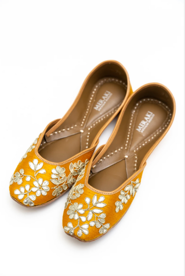 Handcrafted yellow flats, inspired by South Asian Khussa/Jutti design. Made with 100% genuine leather. Intricate embroidery and comfort come together to bring the most perfect flats for any occasion, especially summer dates and weddings. 