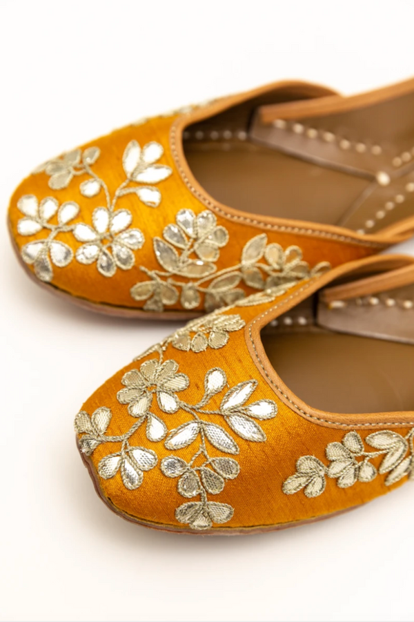 Handcrafted yellow flats, inspired by South Asian Khussa/Jutti design. Made with 100% genuine leather. Intricate embroidery and comfort come together to bring the most perfect flats for any occasion, especially summer dates and weddings. 